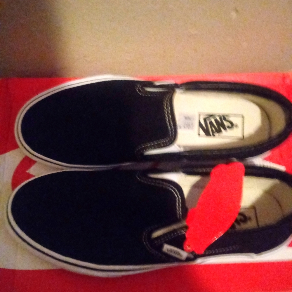 All black slip on vans